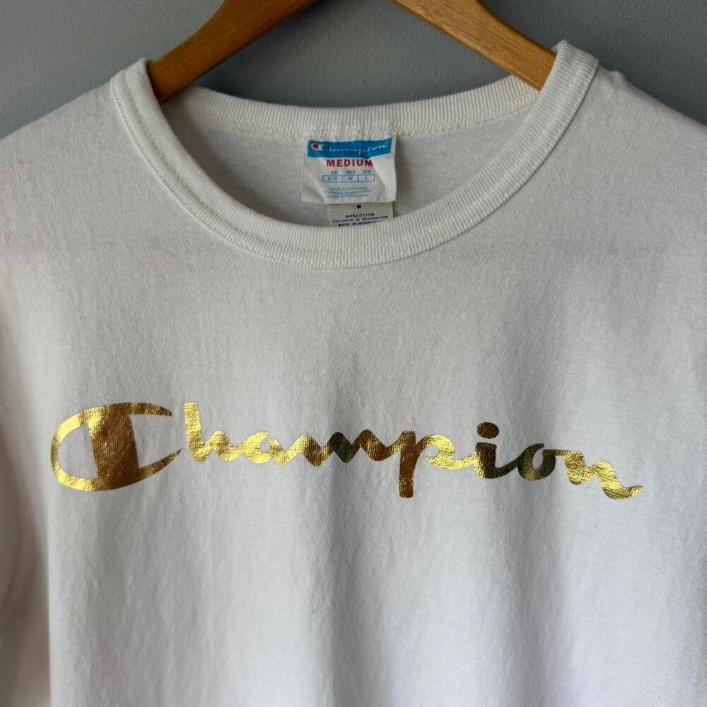 Champion white t-shirt with gold logo (M)